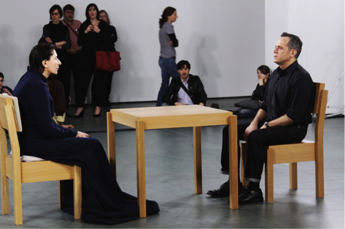 Marina Abramović’s „The Artist is Present“; photo by Shelby Lessig, CC BY SA 3.0.